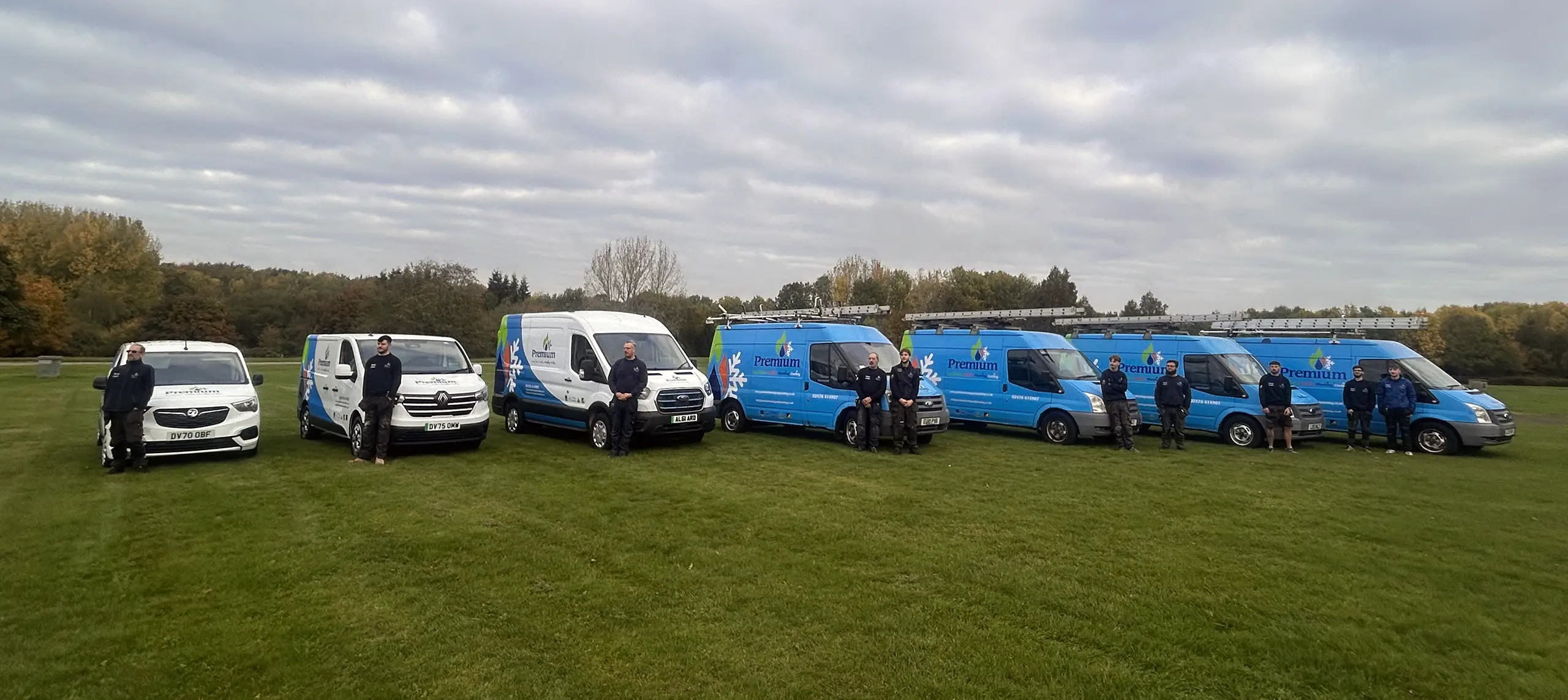 Premium Heating, Plumbing & Cooling Team with the vans